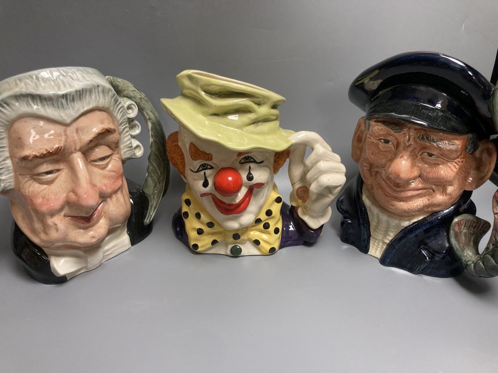 Five Royal Doulton character jugs, a Royal Doulton The Clown character jug and a smaller Winston Churchill character jug